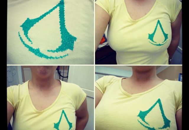 Assassin’ s Creed cross stitch logo on the t-shirt by Facebook Fan Lluvisa Heredia Alvarez-Laviada