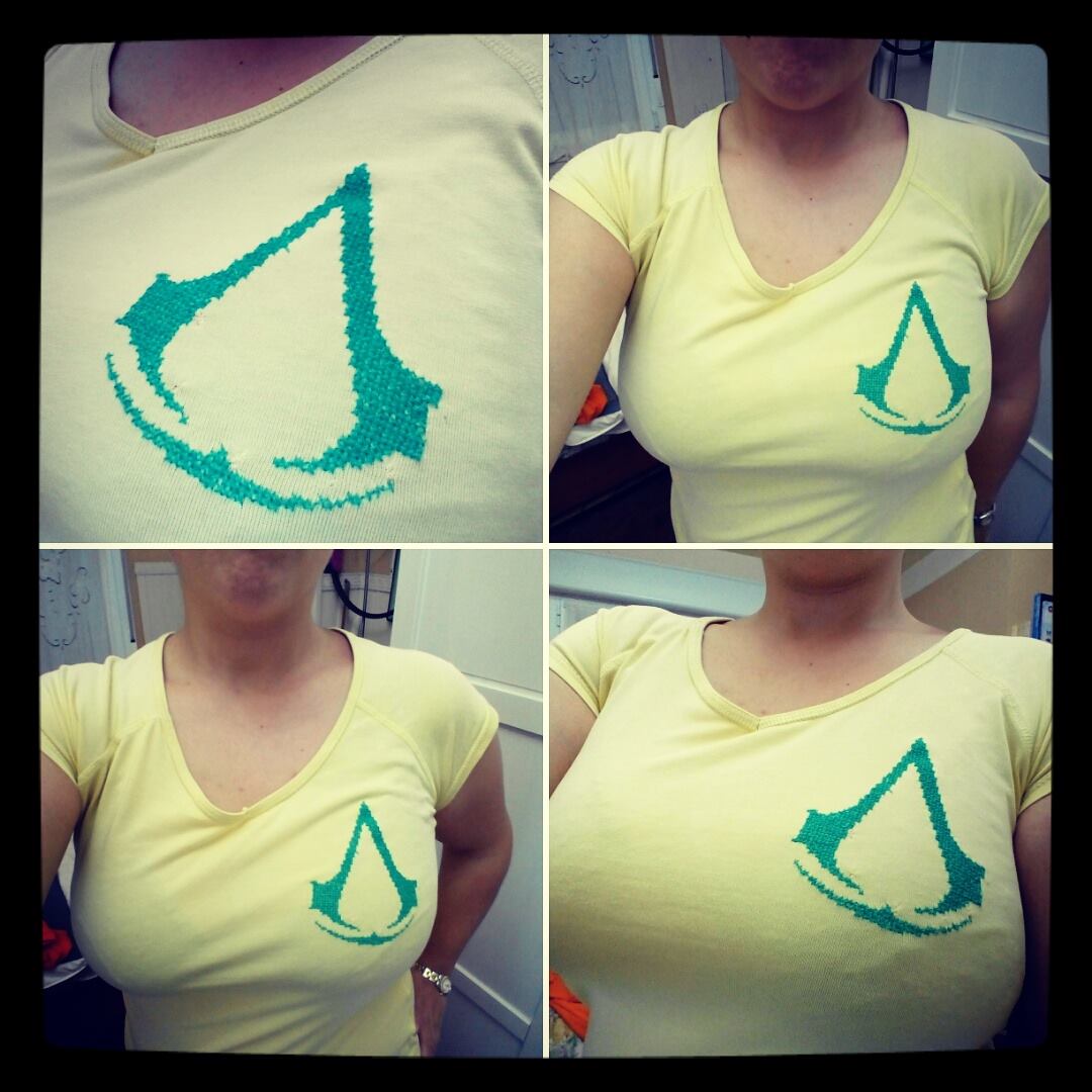 Assassin’ s Creed cross stitch logo on the t-shirt by Facebook Fan Lluvisa Heredia Alvarez-Laviada