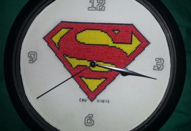 Cross stitch clock with Superman original logo author facebook user Carrie Renae Uetz