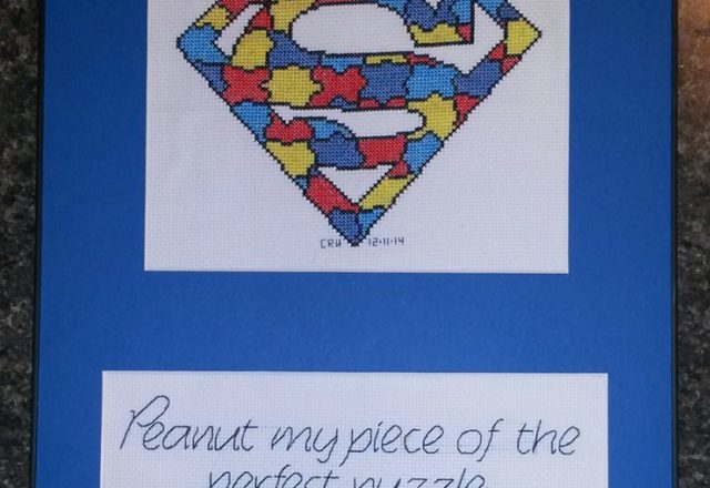 Cross stitch colored puzzle Superman logo work photo author facebook user Carrie Renae Uetz 2