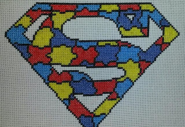 Cross stitch colored puzzle Superman logo work photo author facebook user Carrie Renae Uetz